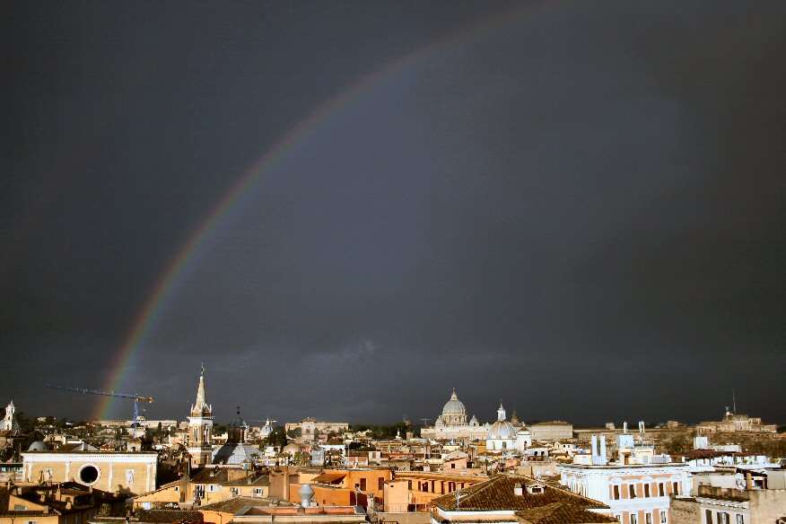 Rainbow and dark sky in Roma